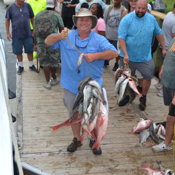 Benoit Groulx et al. walking down a fish