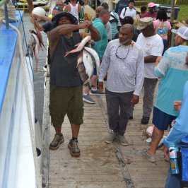 Richard Gant et al. standing in front of a crowd