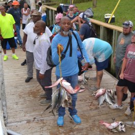 a group of people standing in front of a crowd