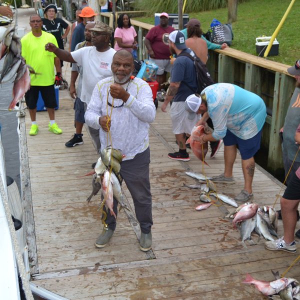a group of people standing in front of a crowd
