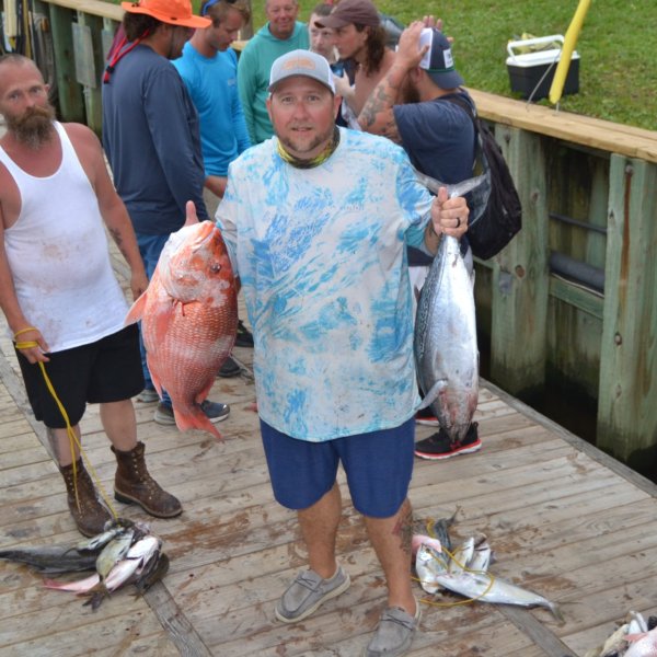 a group of people standing in front of a crowd
