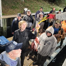 a group of people standing in front of a crowd
