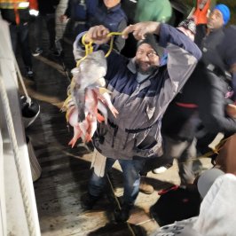 a group of people standing in front of a crowd