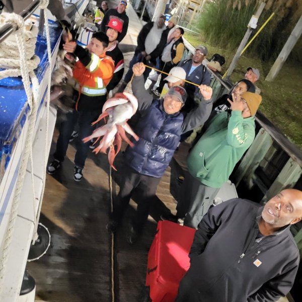 a group of people standing in front of a crowd