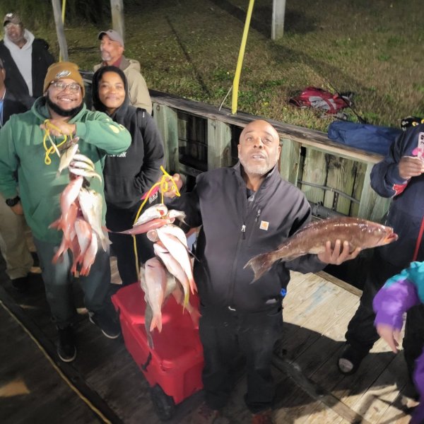 a group of people around each other