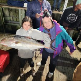 a group of people around each other