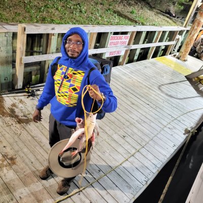 a person riding on the back of a wooden fence