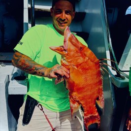 a man holding an animal