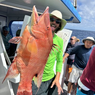 a person holding a fish