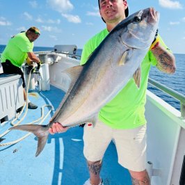a man holding a fish