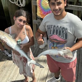 a person holding a fish