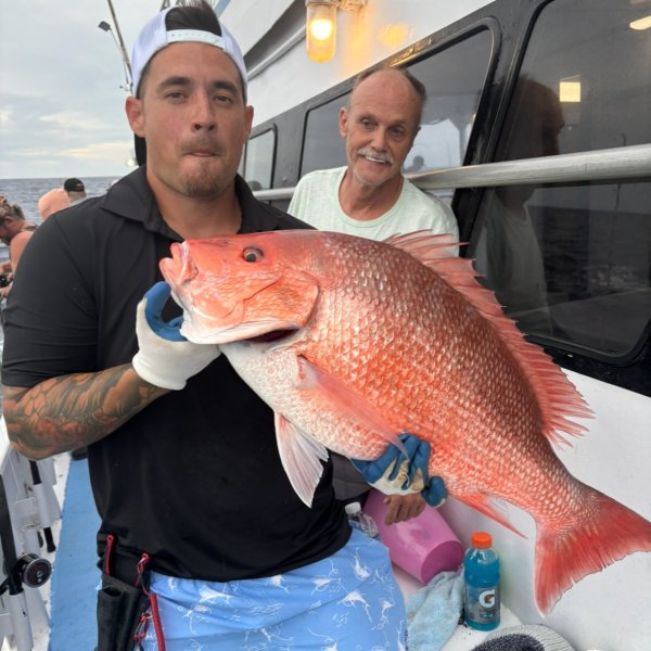 a man holding a fish
