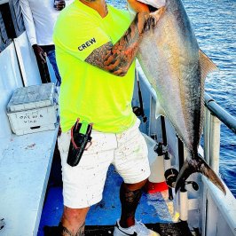 a man holding a fish