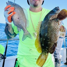 a man holding a fish