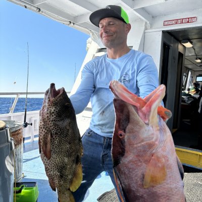 a man holding a fish