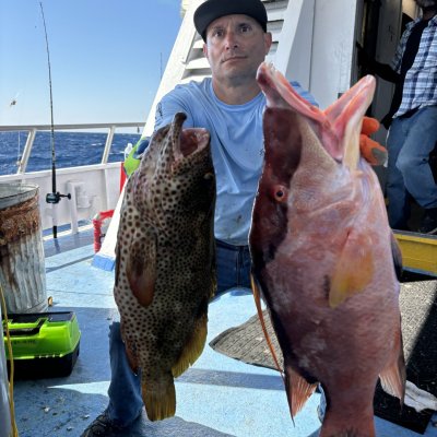 a person holding a fish