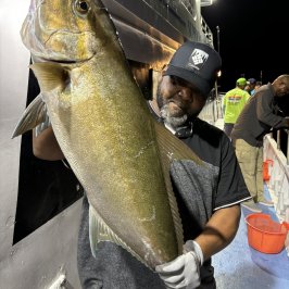 a person holding a fish