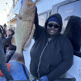 a person holding a fish