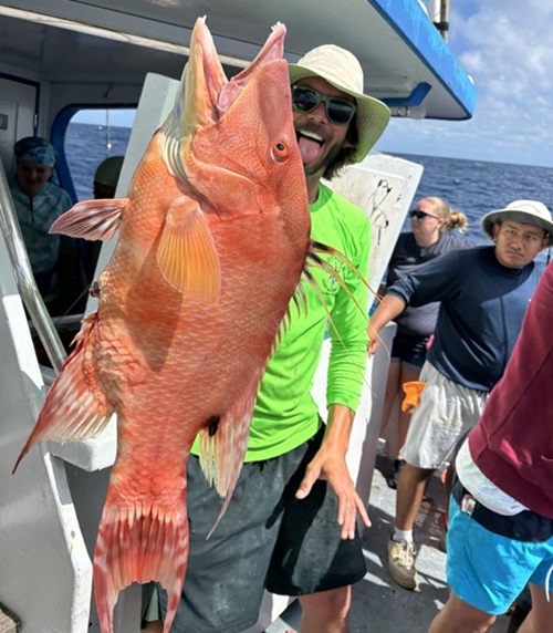 Deep sea fishing in Myrtle Beach SC a group of people standing in front of a bird