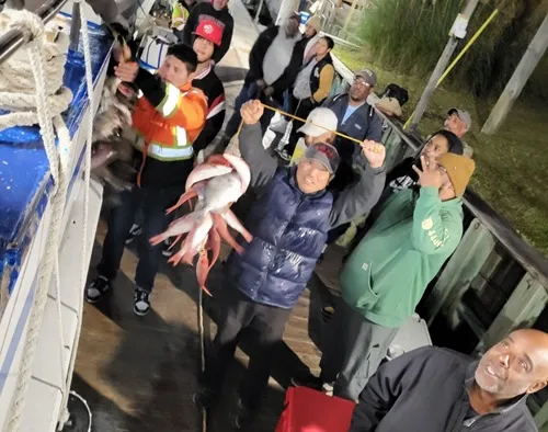 fishing trip in Myrtle Beach SC a group of people standing in front of a crowd