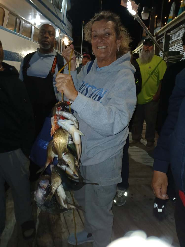 a person holding a fish