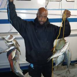 a man holding a fish