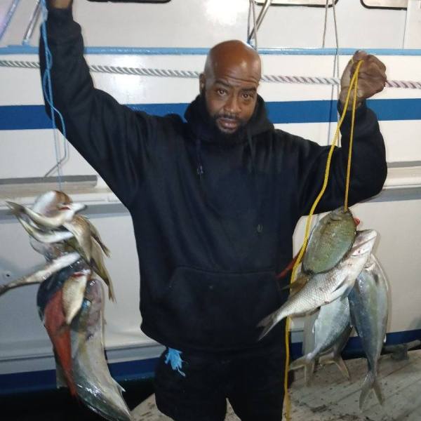 a man holding a fish