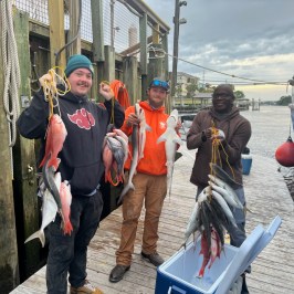 a group of people standing on a bridge